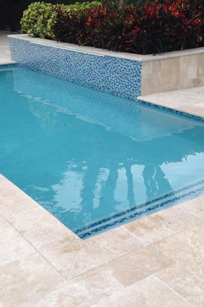 Travertine Stone Decking for Infinity Pool – Natural Beauty