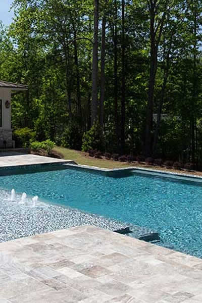 Modern Pool Design with Silver Travertine Pavers – Elegant Look
